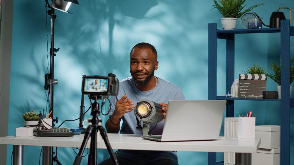 african american blogger reviewing studio light on camera