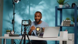 african american blogger reviewing studio light on camera