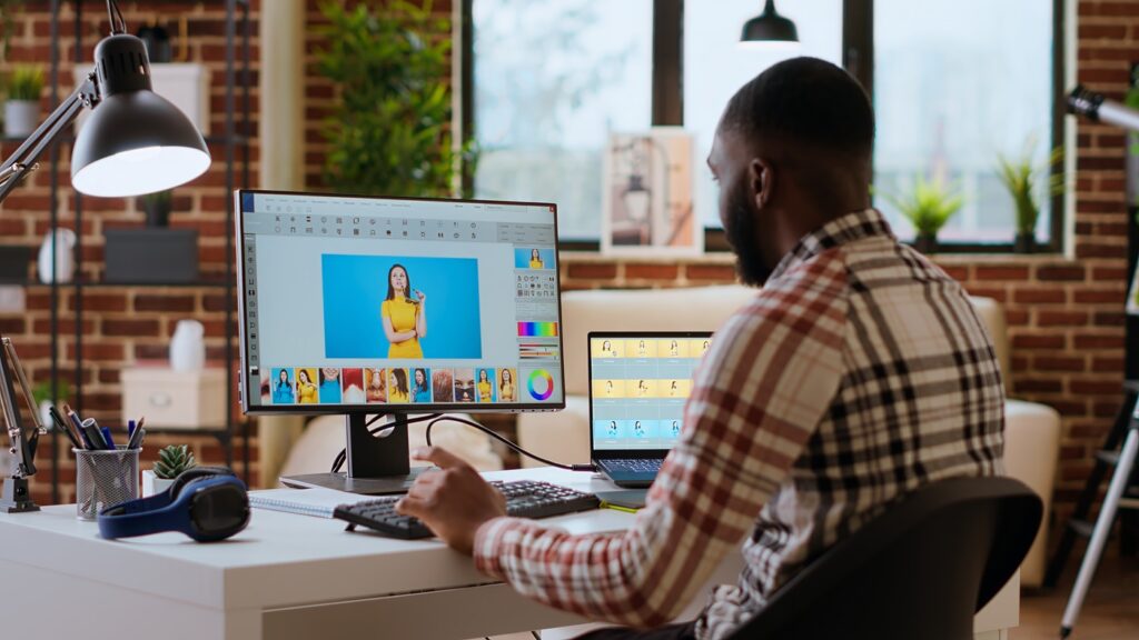 freelance graphic designer editing photos on a modern computer setup
