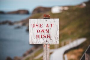 use at your own risk signage. The risk of hiring unverified freelance designers